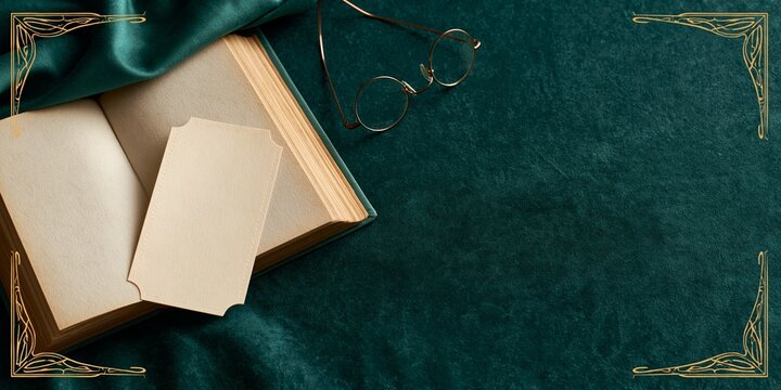 Vintage book with blank card and glasses