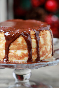 Portion of traditional Christmas cheesecake covered with chocolate.