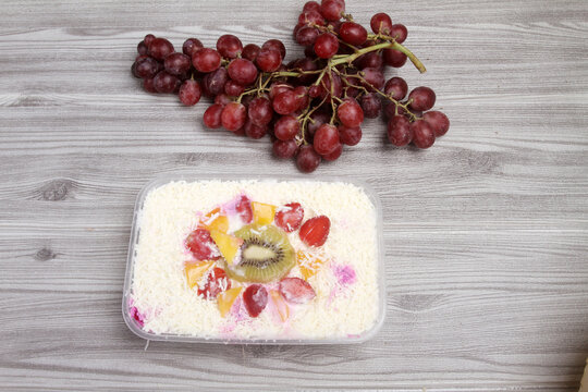 salad with grated cheese an fresh fruits.