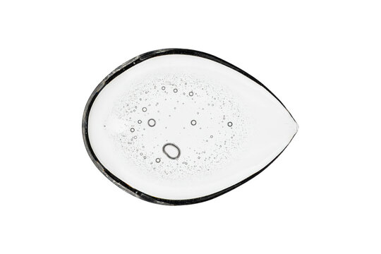 A single teardrop shaped clear gel drop with tiny air bubbles suspended inside the viscous liquid substance isolated on a transparent background