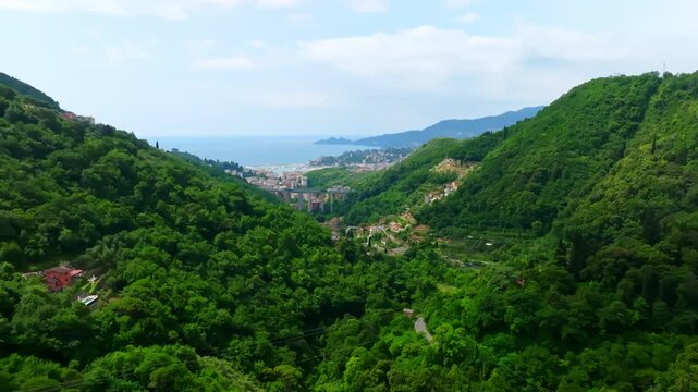 Aerial view approaching the Rapallo Village and Tigullio Gulf, summer in Italy