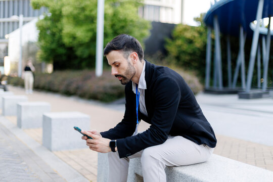 Business man using smartphone on a break