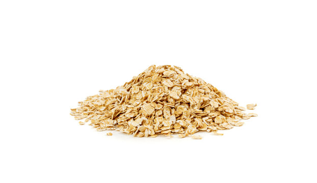 Dry raw oat flakes isolated, rolled flat grains, instant porridge, thin cereals, flattened grains group