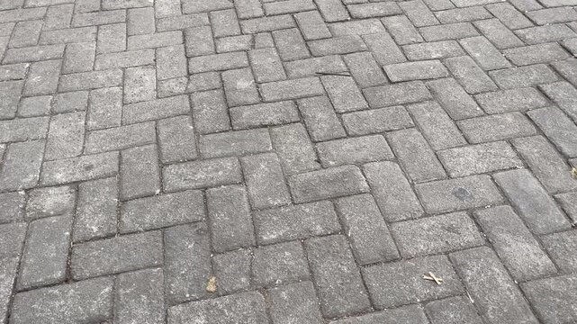 High Angle View of Grey Herringbone Paving Blocks