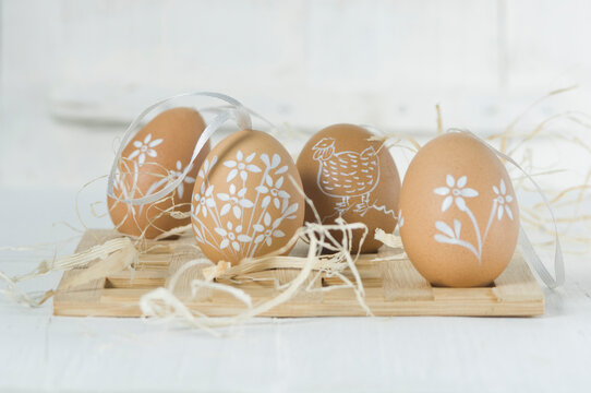 Painted Easter eggs with staw