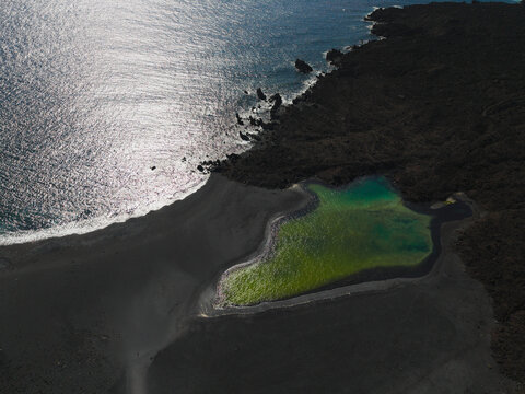 An aerial view shows the green lagoon at Charco de Montana Bermeja