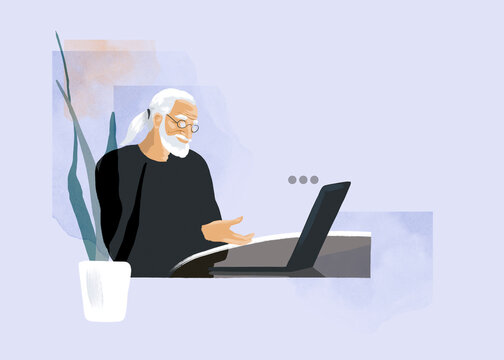 Senior freelancer types a message on his laptop