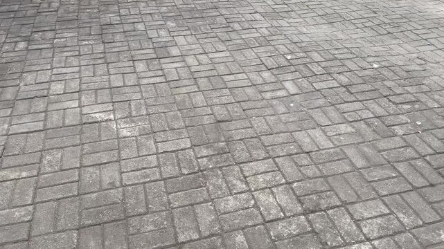 Grey rectangular concrete paving blocks pavement texture background