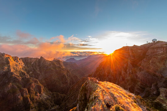 Sunrise over mountain ridge with radar station in Madeira Portugal