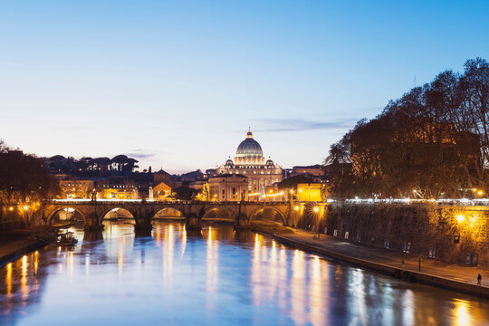 Italy, Rome, St. Peter's Basilica and Ponte Sant'Angelo in the evening