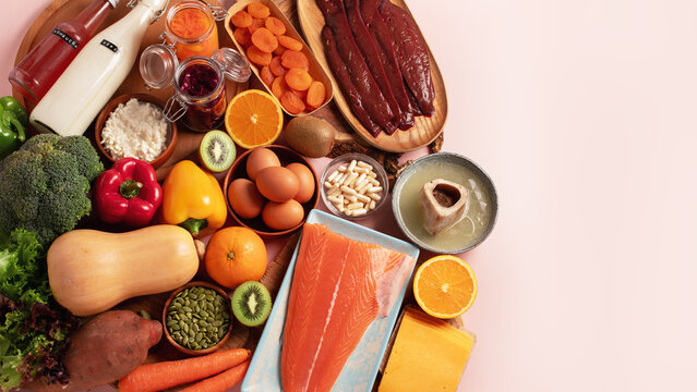 Flatlay banner of glass skin diet foods: salmon, liver, bone broth, kefir, eggs, collagen sources