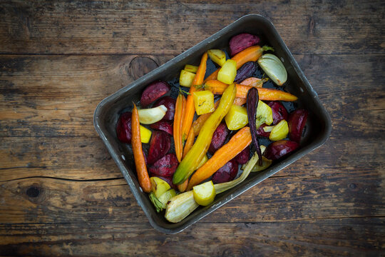 Oven winter vegetables, carrot, beetroot, potato and parsnip in roasting tray