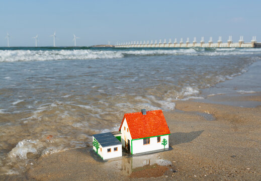 Model house on floodline near Oosterschelde storm surge barrier in Netherlands
