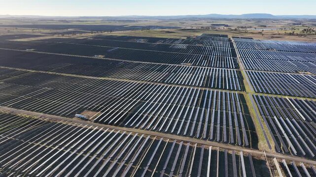Aerial View of Large Scale Solar Farm in Rural Landscape