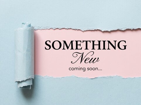 Something New coming soon text on pink background, torn blue paper reveal, creative announcement concept for marketing