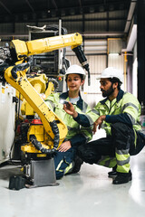 Industrial robot factory worker technician automation manufacturing
