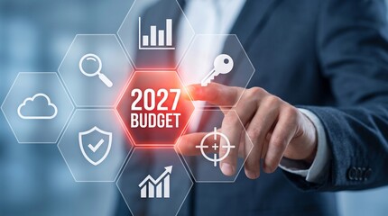 Obraz premium Business professional touching holographic 2027 budget planning screen with growth icons financial forecasting business strategy corporate finance data visualization