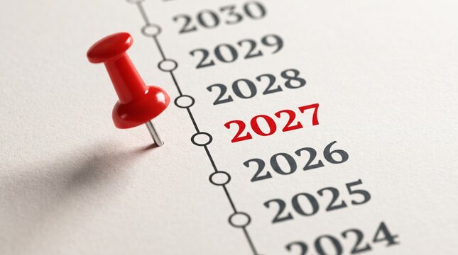 Red push pin marking the year 2027 on a timeline planner with timeline calendar planning scheduling deadlines business management milestone strategy objective appointment