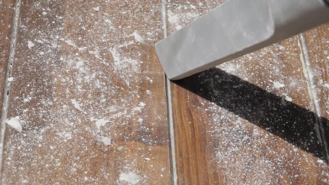 Using  vacuum cleaner on wooden floor