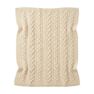 Couverture en tricot torsad&eacute; beige