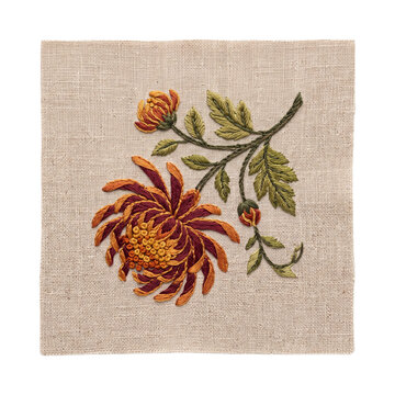 Intricate needlepoint embroidery of a chrysanthemum flower on patterned textile with embroidery chrysanthemum needlepoint stitched handmade