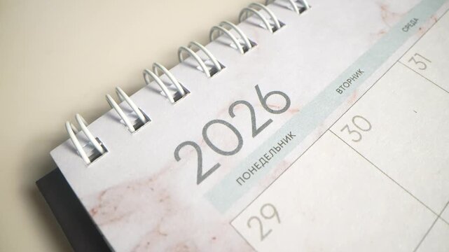 Hand, writing and calendar for schedule, planning and organization with timeline for tasks or event. Priority, agenda and goals with person for productivity, time management and reminder for deadline
