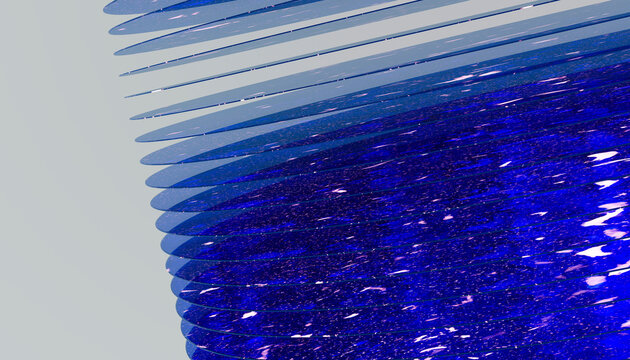 Blue glass sculpture with layered curved panels in studio environment