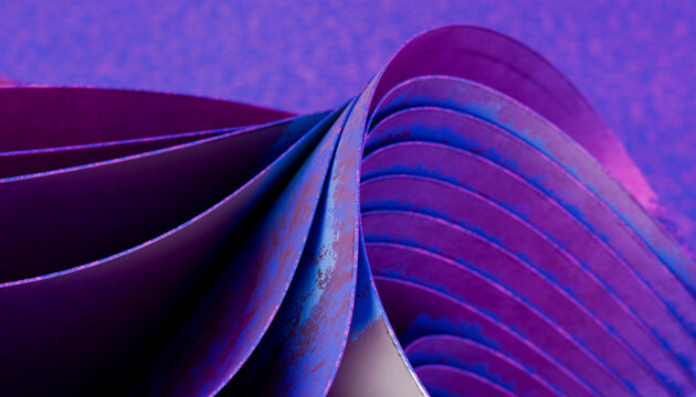 Folded sheets of blue and purple paper with abstract texture