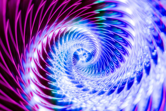 Abstract colorful spiral light pattern with blue and pink reflections