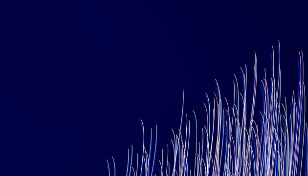 Light streaks forming colorful vertical lines on dark blue background