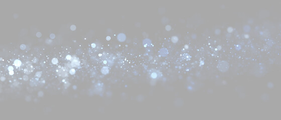 Glowing blue and white light particles on a transparent background. Horizontal sparkling bokeh and glitter overlay effect. Floating magic dust and shimmering stars. Isolated Asset  © Russell Edwards 56