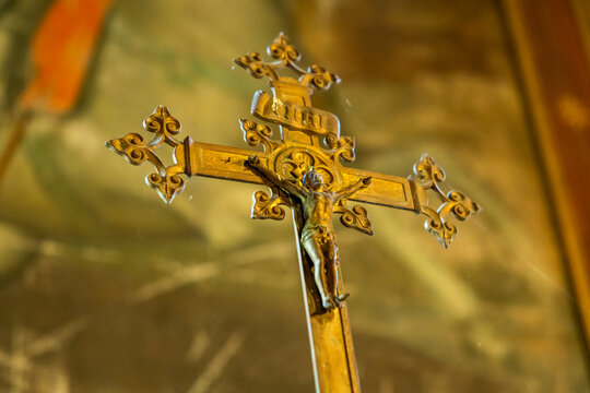 Close-up of a gilded altar crucifix with an INRI inscription, Gers, Saint Georges, France