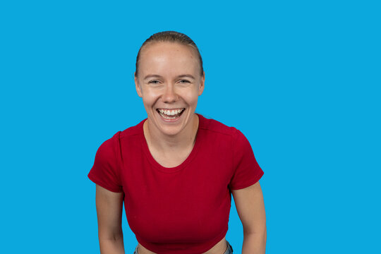 Woman laughing happily expressing joy and excitement