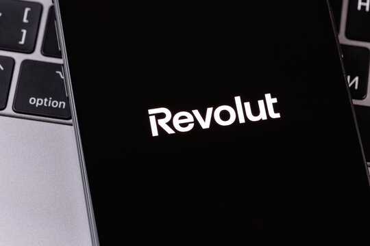 Revolut logo mobile app on a screen smartphone iPhone. Revolut is a global financial technology company. Batumi, Georgia - July 7, 2026