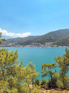 View of Fethiye marina and houses from the seaside on a sunny day