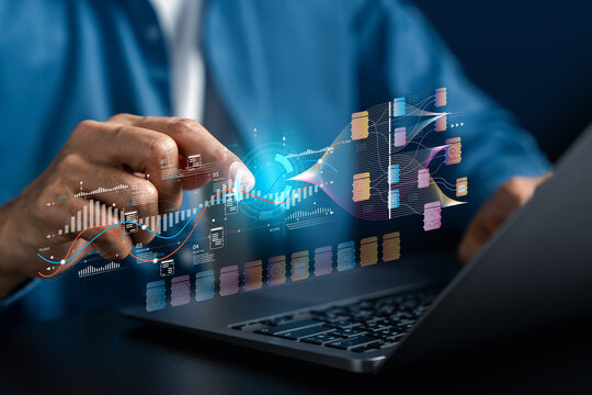 Big data machine learning data analysis and cloud computing network. Man typing on laptop computer keyboard with futuristic digital hologram files graph.