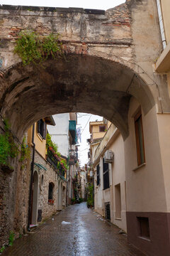 Vico Raffaele Piria, a pretty cobbled lane in Scilla, Calabria, southern Italy, on an unseasonably wet morning