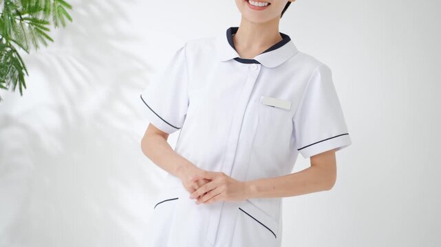 A smiling woman in a white coat. Nurse, caregiver, hospital, clinic, guidance, customer service, cheerful, satisfaction, medical office work, reception, qualifications