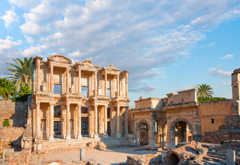 Celsus Library in Ephesus palm tree in the background - Selçuk, Turkey © muratart