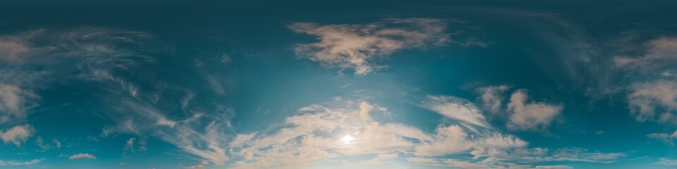 Fototapeta premium Sky clouds panorama showing a 360 degree view of a bright blue atmosphere with wispy white cirrus clouds during daytime