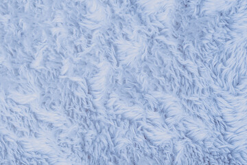 Detailed close up view of gentle light blue fluffy fleece textile material surface background © reddish