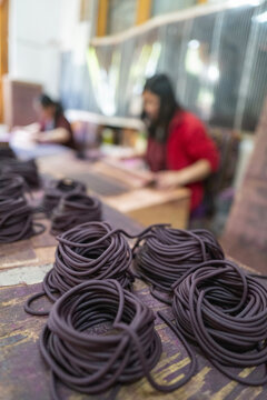 Coils of incense paste drying at Nado Poizokhang artisan workshop, Chang Gewog, Thimphu, Bhutan