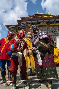 Masked cham dancers performing in a dzong courtyard, Thimphu District, Thimphu, Bhutan