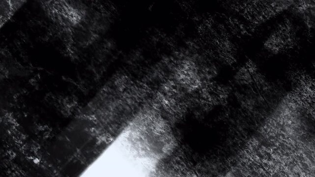 Video transition with dry charcoal strokes. An artistic texture of hand drawn marks creates a rough sketching effect for changing video frames.