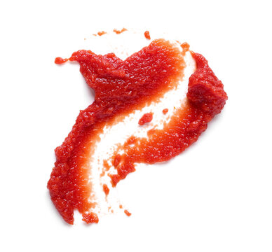 Smears of fresh tomato paste on white background