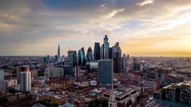 Hyper timelapse view of the office skyscrapers and the skyline at the City of London, England, during sunset time