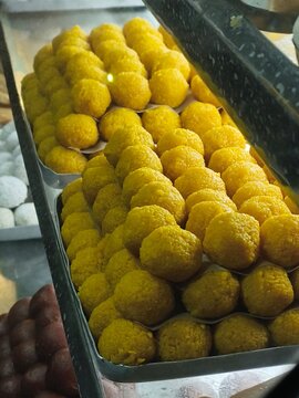 Yellow Motichoor Laddu Sweets in Indian Sweet Shop Tray