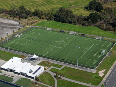 Aerial view of Knox Regional Football Centre featuring a synthetic soccer pitch with white markings, floodlights, and an adjacent clubhouse in Wantirna South, Victoria, Australia.