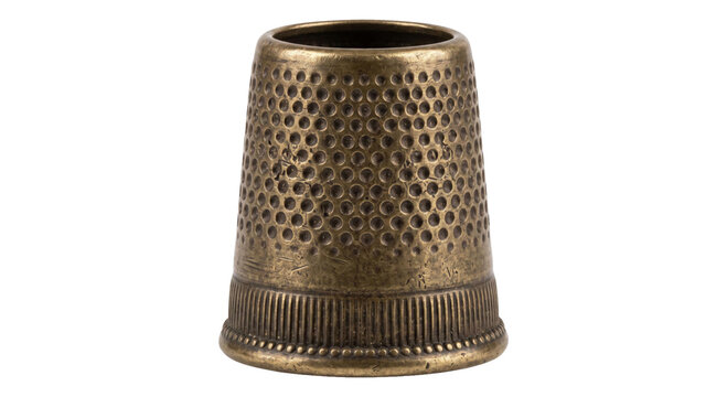 Antique brass thimble with dimpled texture and ribbed base for sewing