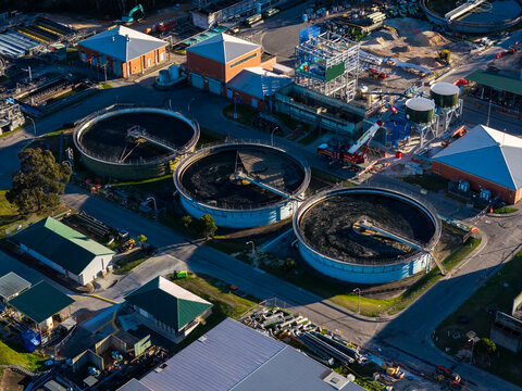 Aerial view of circular clarifiers at a water resource recovery facility undergoing a treatment plant upgrade in Rouse Hill, New South Wales, Australia.